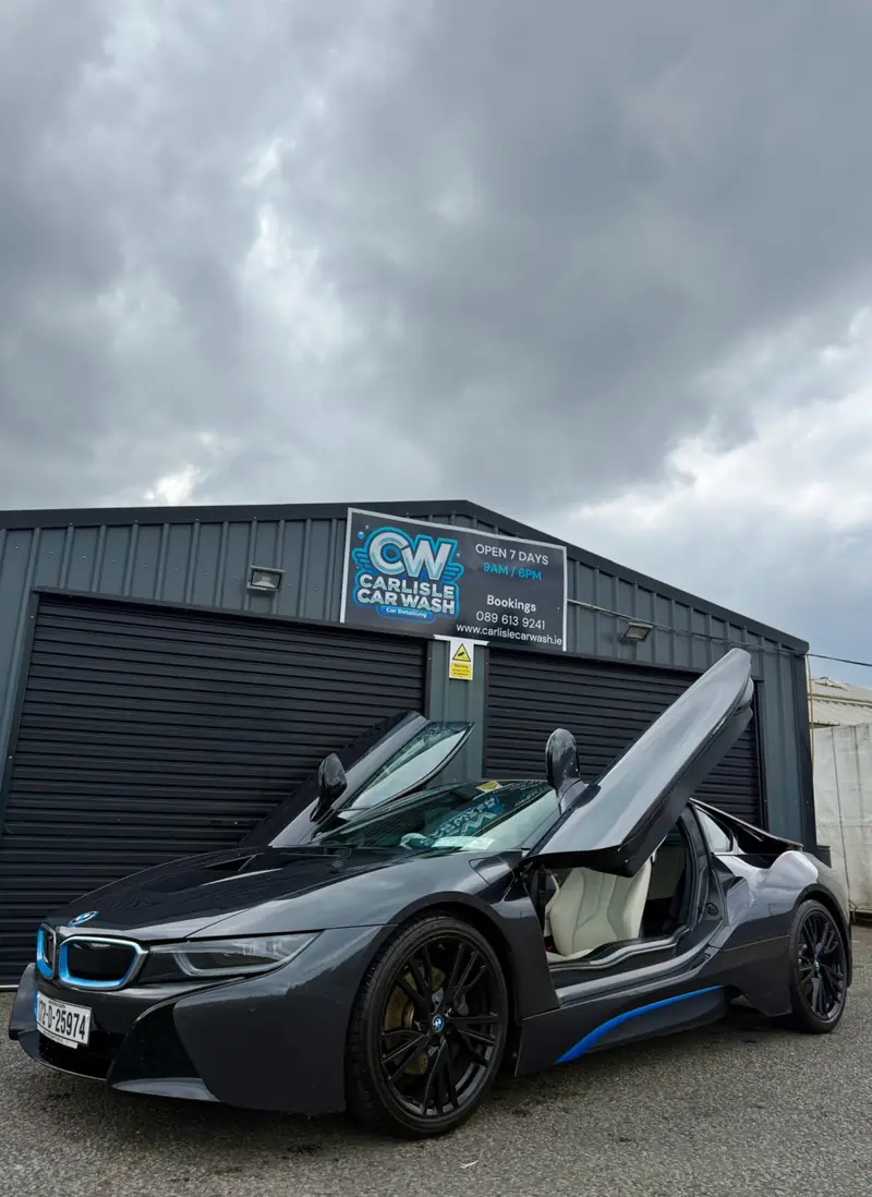 BMW i8 with its doors open outside Carlisle Car Wash